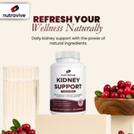 Nutravive kidney support supplement bottle with cranberries and a glass of water on a beige background.
